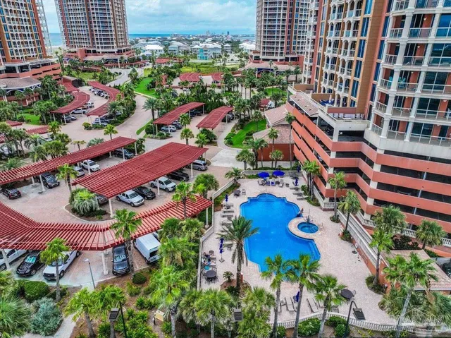 an aerial view of residential houses with outdoor space and street view