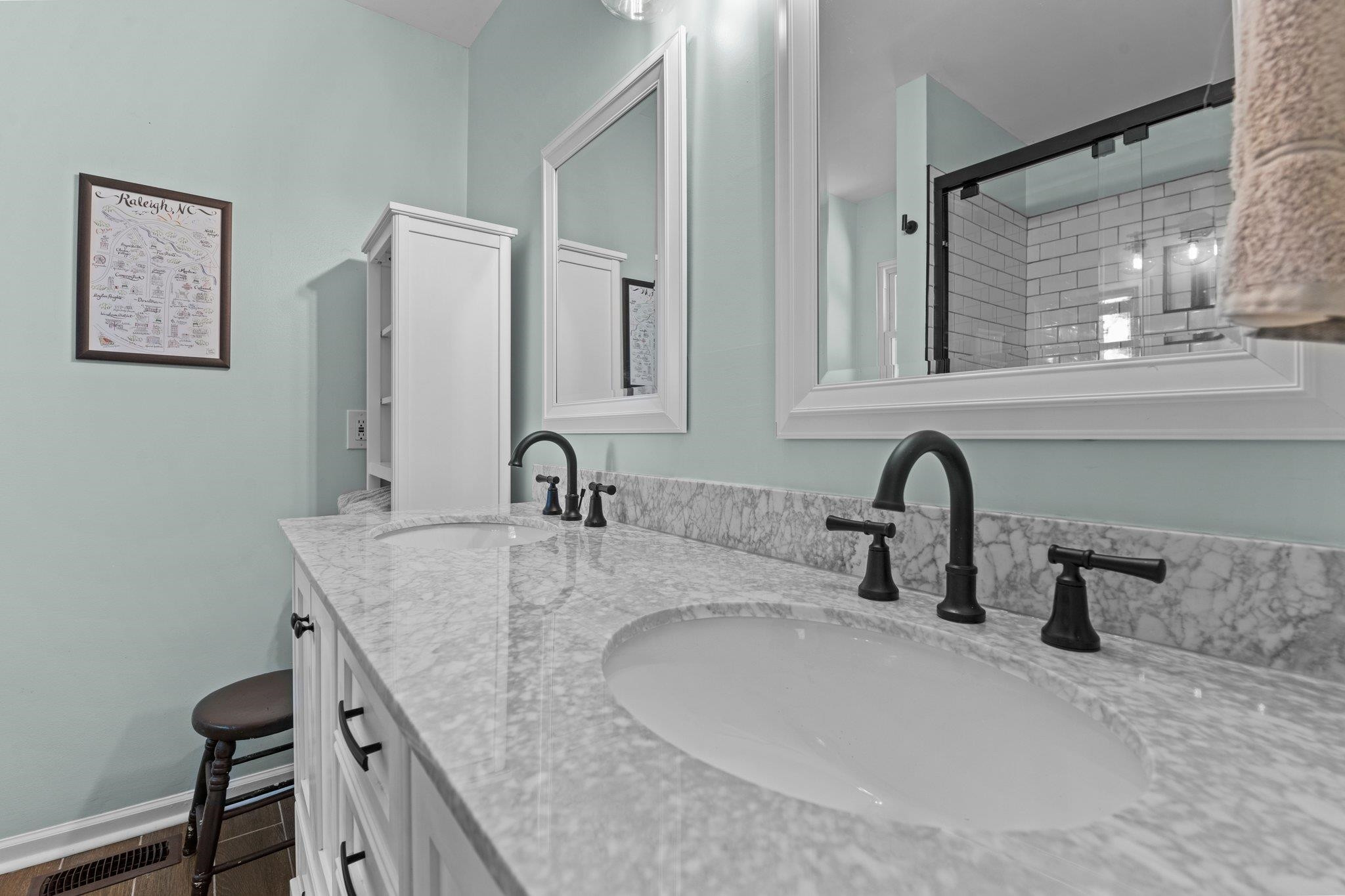 5421 Old Towne Road Raleigh, NC 27612 - Photo 17 of 39 Updated Primary Bathroom with dual vanity sinks and walk-in shower. Primary Bathroom
