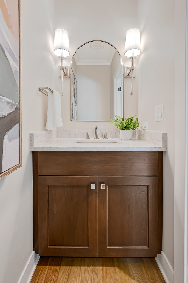 143 Harding Avenue Glen Ellyn, IL 60137 - Photo 17 of 40 a bathroom with a sink and a mirror