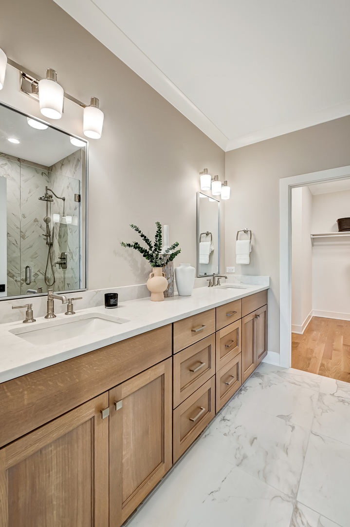143 Harding Avenue Glen Ellyn, IL 60137 - Photo 21 of 40 a spacious bathroom with double sink and a mirror