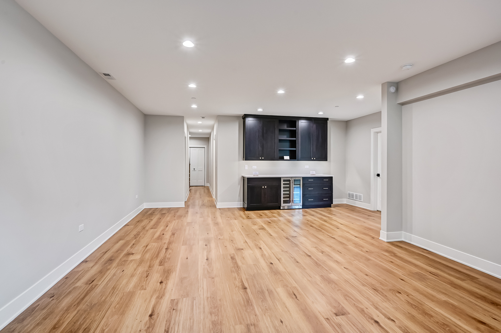 143 Harding Avenue Glen Ellyn, IL 60137 - Photo 33 of 40 an empty room with wooden floor and fireplace