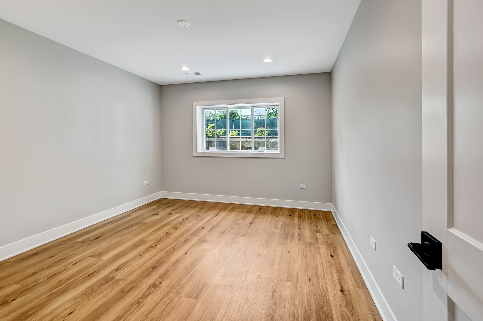 143 Harding Avenue Glen Ellyn, IL 60137 - Photo 35 of 40 a view of an empty room with wooden floor and a window