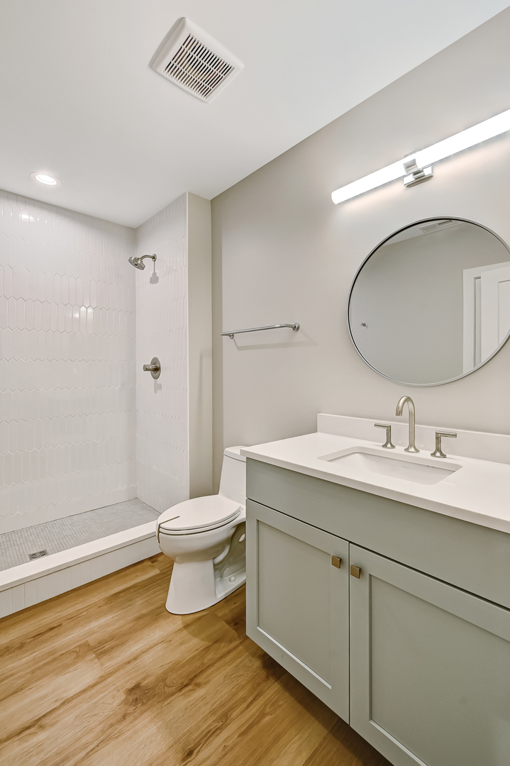 143 Harding Avenue Glen Ellyn, IL 60137 - Photo 36 of 40 a bathroom with a toilet a sink and mirror