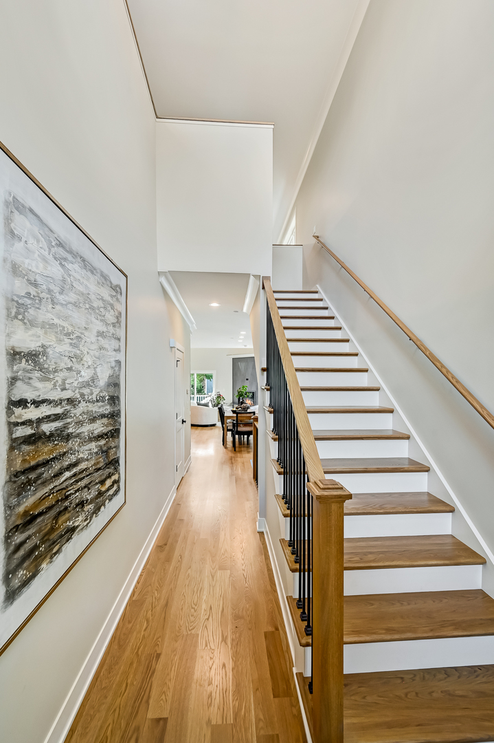 143 Harding Avenue Glen Ellyn, IL 60137 - Photo 4 of 40 a view of entryway and hall with wooden floor