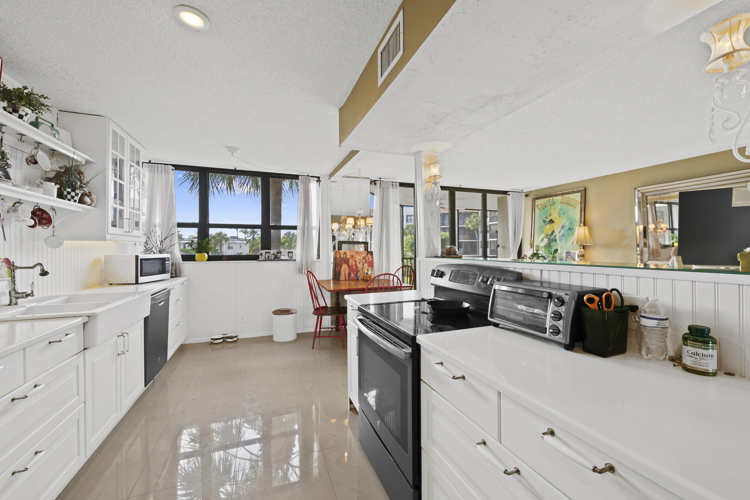 a kitchen with cabinets a sink and appliances