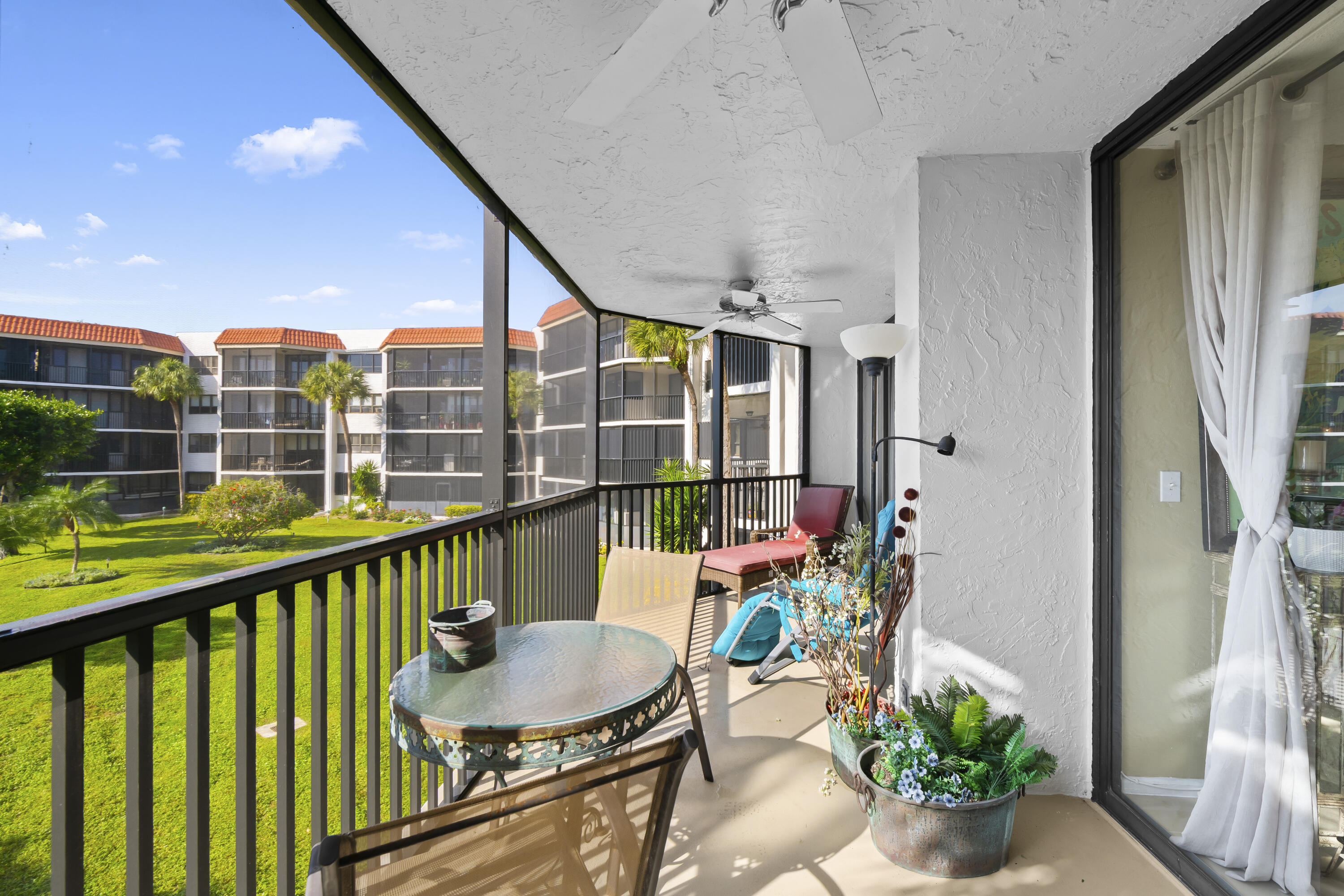 800 Jeffery Street, Unit 204 Boca Raton, FL 33487 - Photo 11 of 36 a view of balcony with furniture and garden
