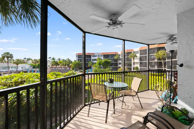 a view of a balcony with furniture