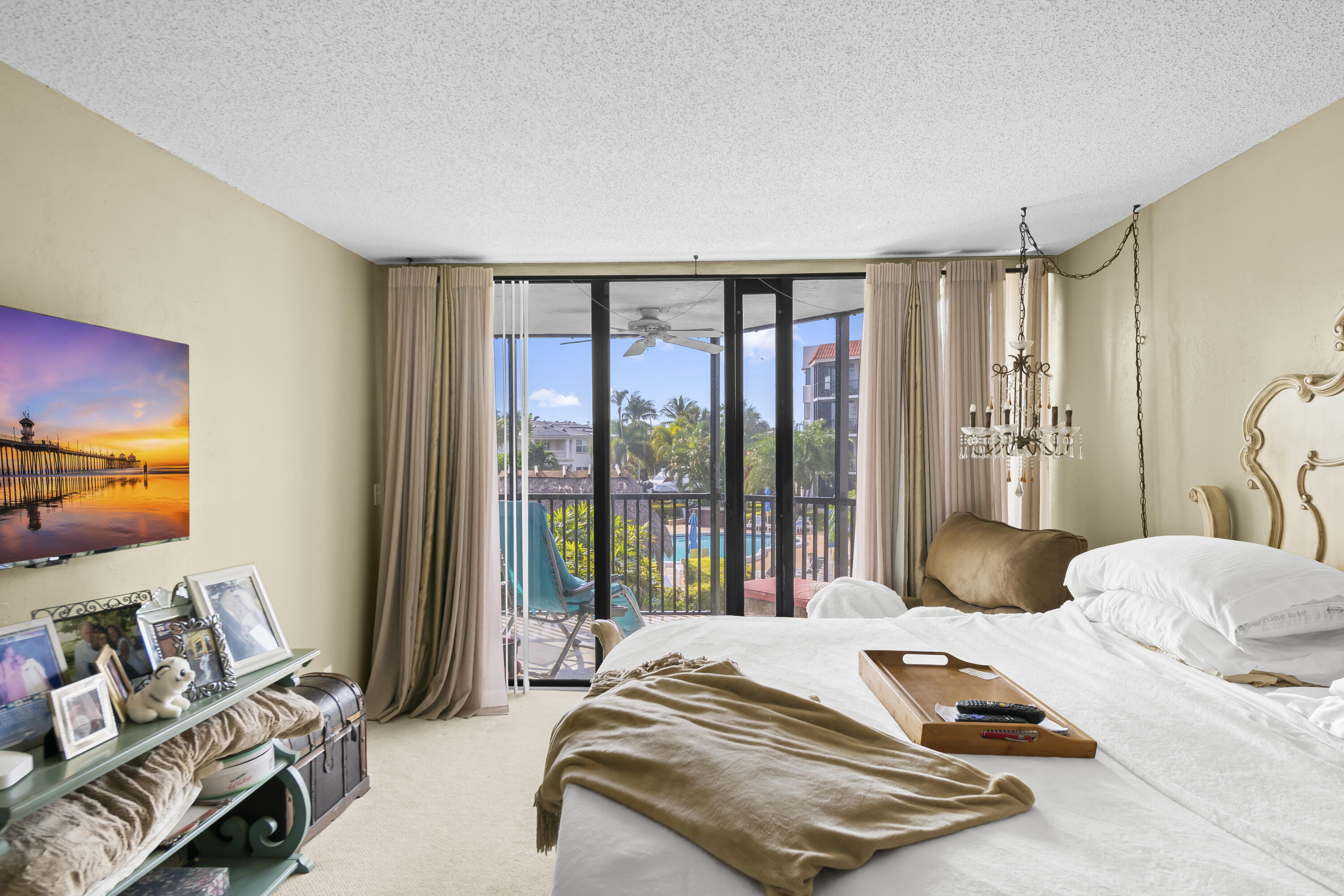 800 Jeffery Street, Unit 204 Boca Raton, FL 33487 - Photo 14 of 36 a bedroom with a bed and large windows