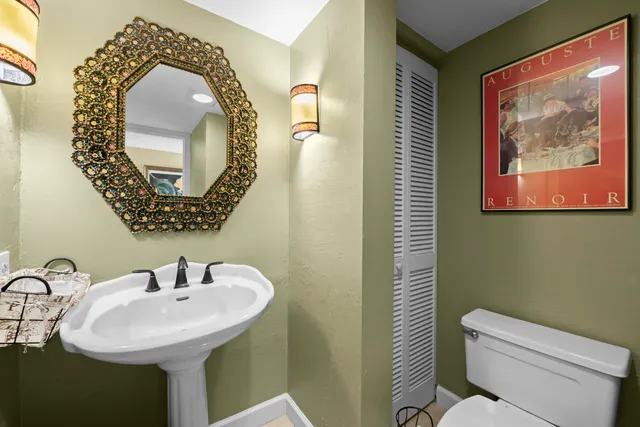 a bathroom with a toilet and a sink