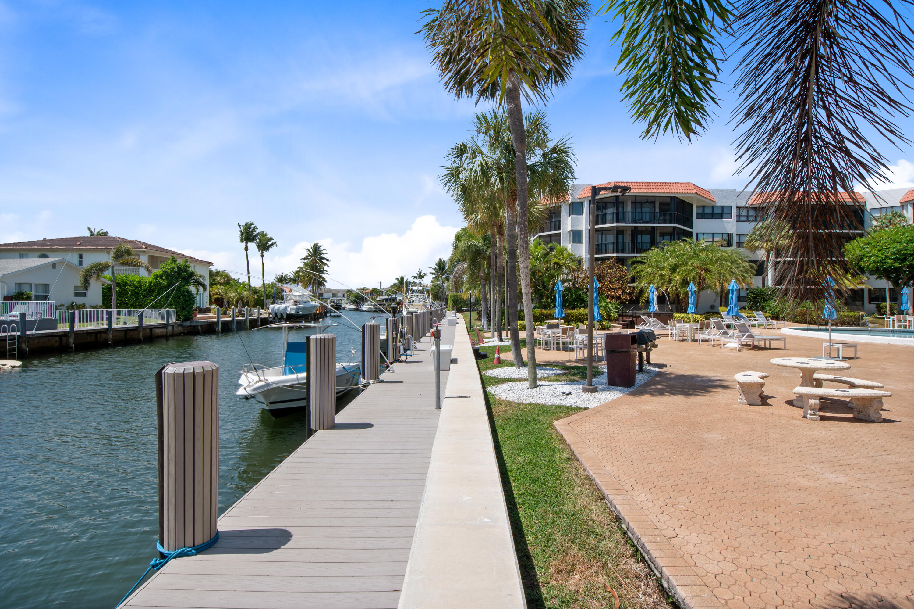 800 Jeffery Street, Unit 204 Boca Raton, FL 33487 - Photo 26 of 36 a swimming pool with outdoor seating and yard