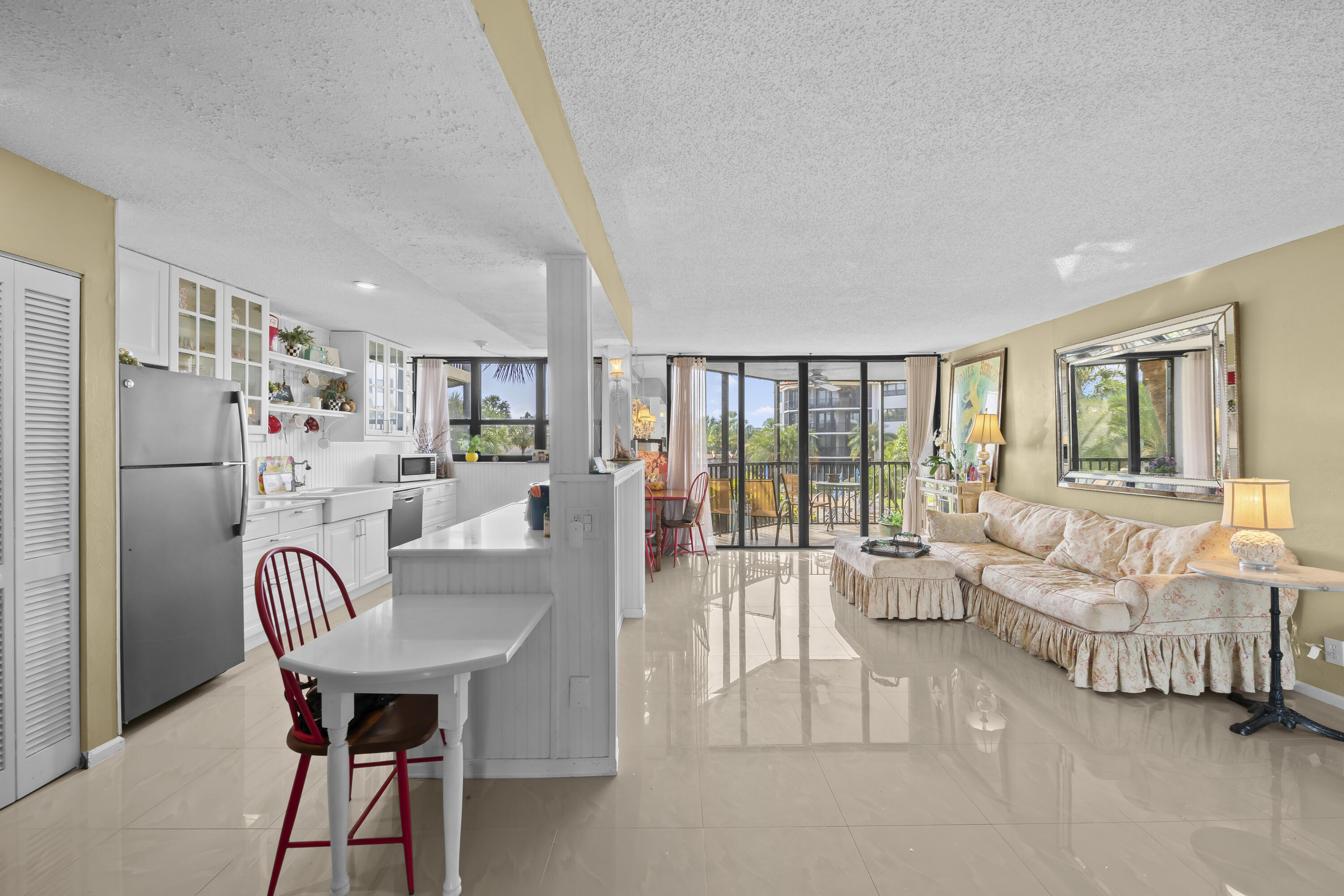 800 Jeffery Street, Unit 204 Boca Raton, FL 33487 - Photo 3 of 36 a living room with furniture and a large window