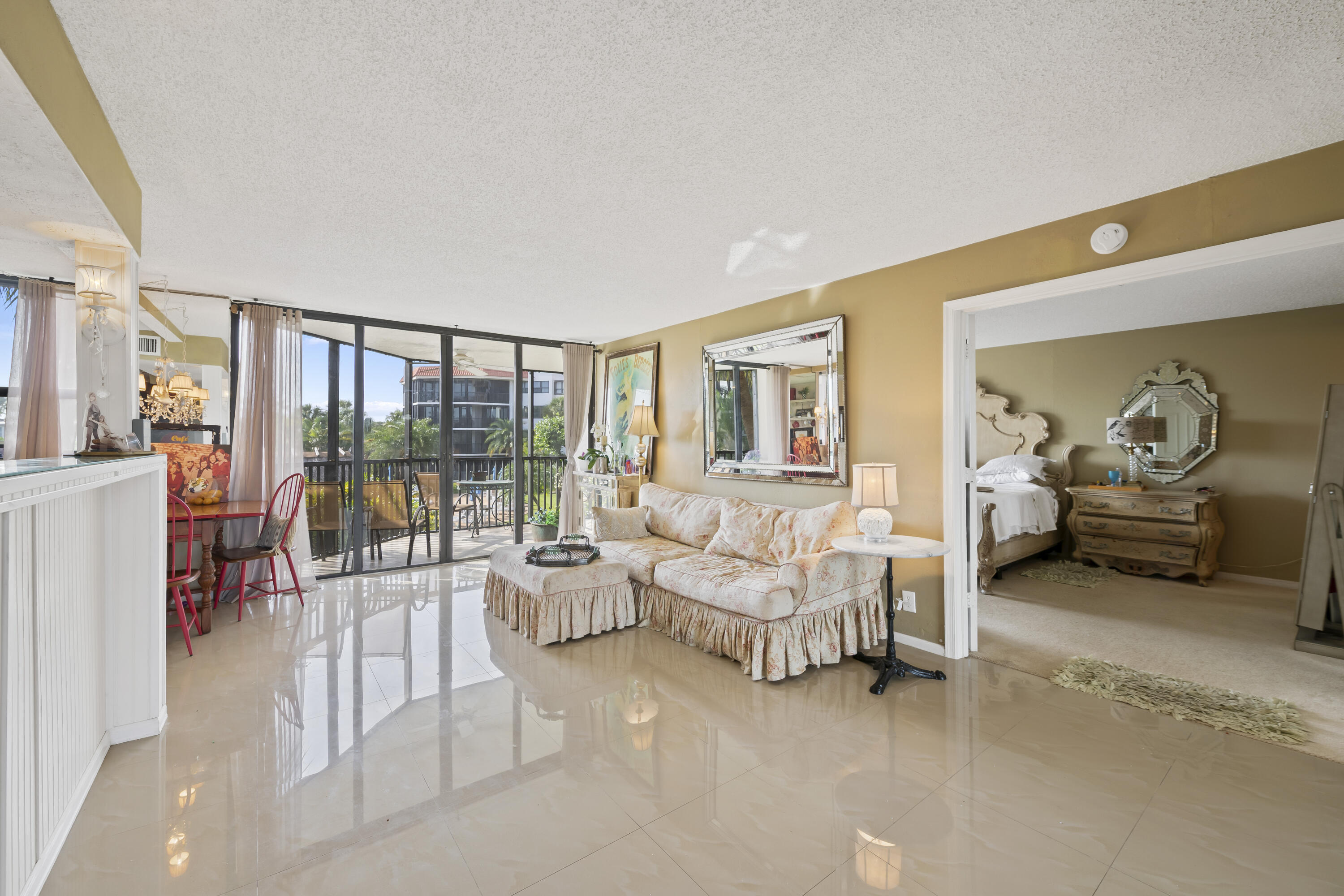 800 Jeffery Street, Unit 204 Boca Raton, FL 33487 - Photo 4 of 36 a living room with furniture and a large window