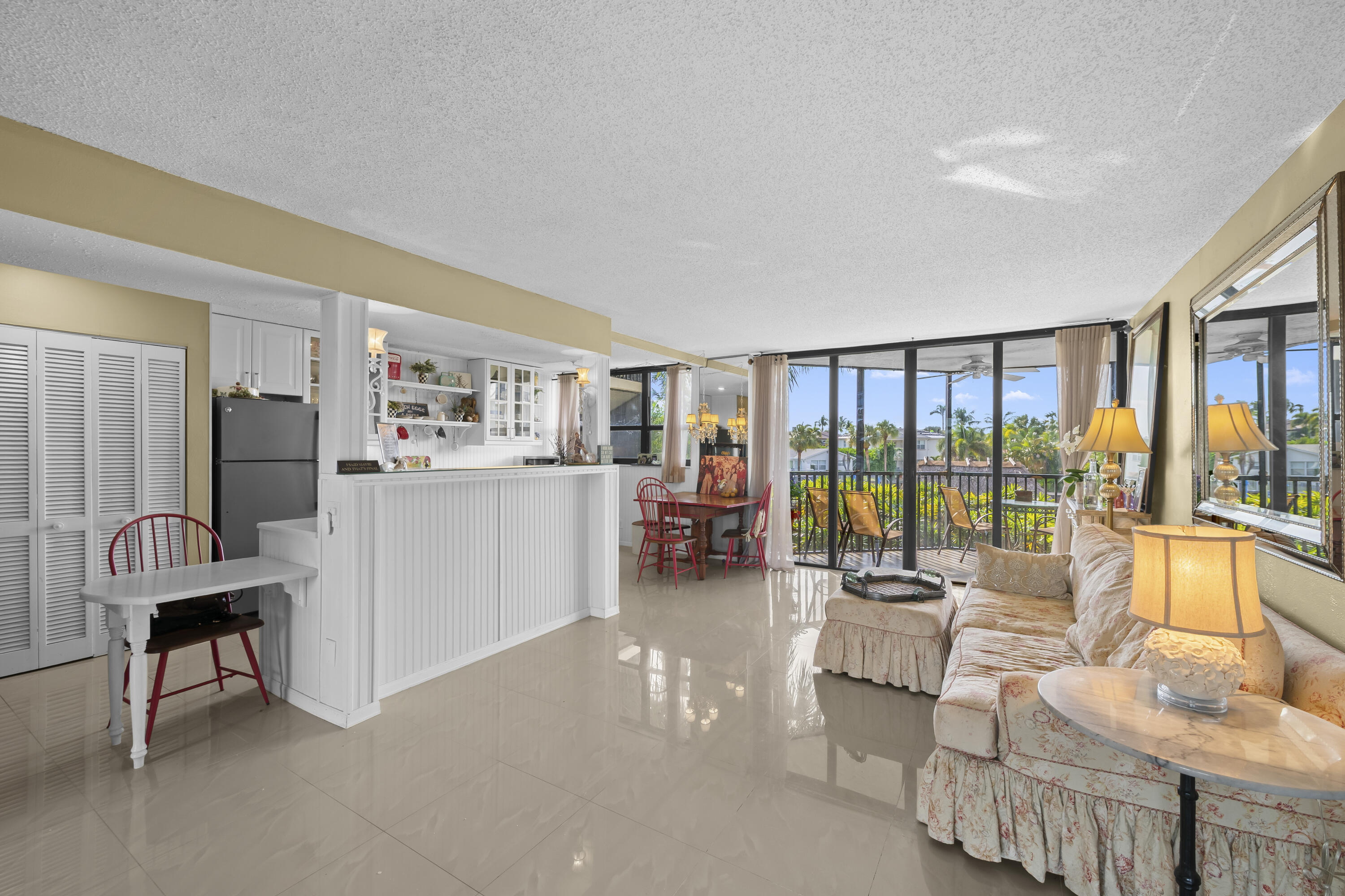 800 Jeffery Street, Unit 204 Boca Raton, FL 33487 - Photo 5 of 36 a living room with furniture and a floor to ceiling window