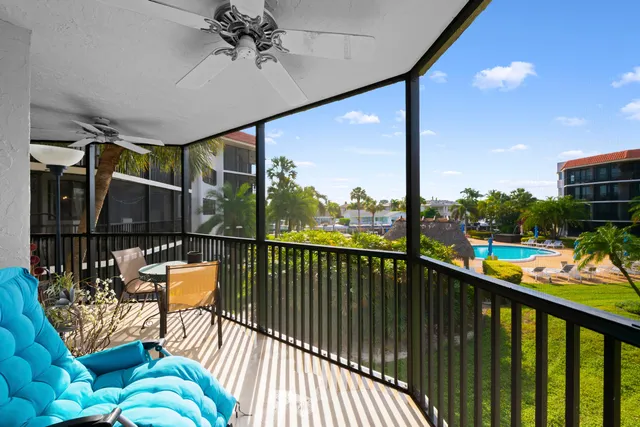 a view of a balcony with chairs