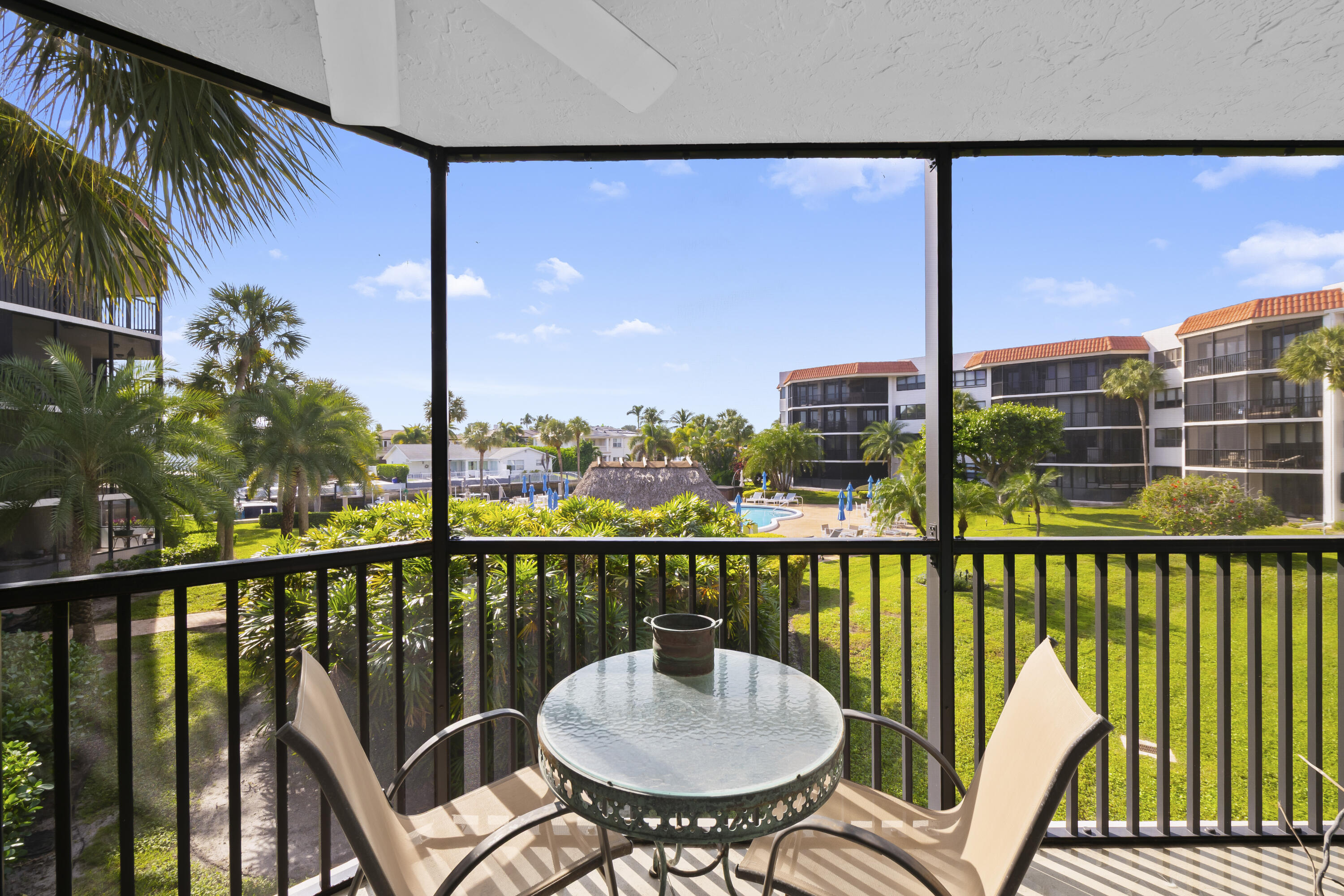 800 Jeffery Street, Unit 204 Boca Raton, FL 33487 - Photo 10 of 36 a view of a balcony with a table and chairs