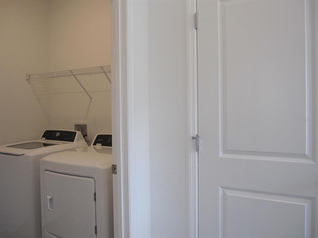 4530 Northwest 14th Loop Ocala, FL 34482 - Photo 14 of 40 a utility room with dryer and washer