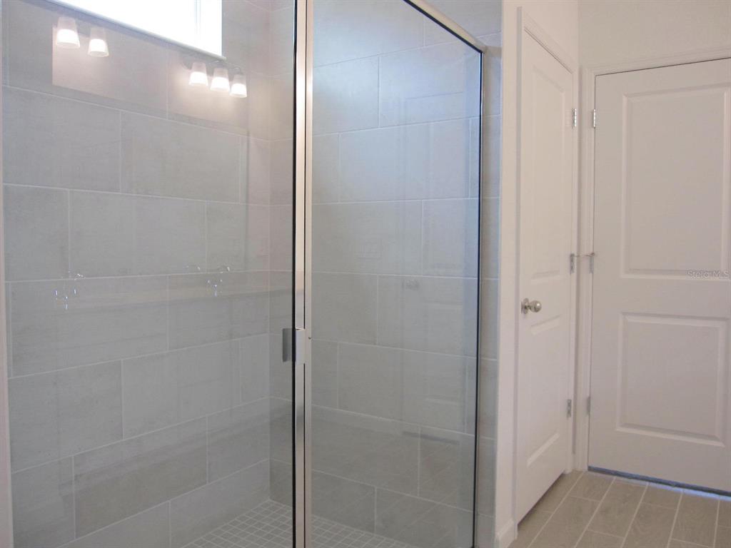 4530 Northwest 14th Loop Ocala, FL 34482 - Photo 26 of 40 a bathroom with a shower