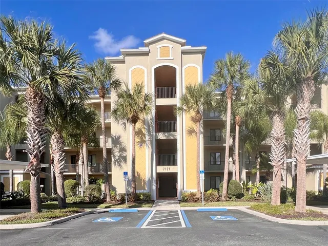 front view of a brick house with a clock on it