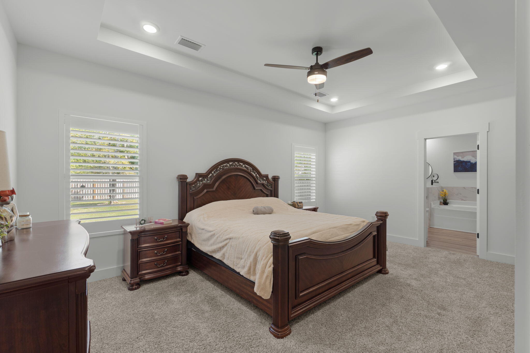 136 Hibernate Way Freeport, FL 32439 - Photo 21 of 55 a bedroom with a bed and a chandelier