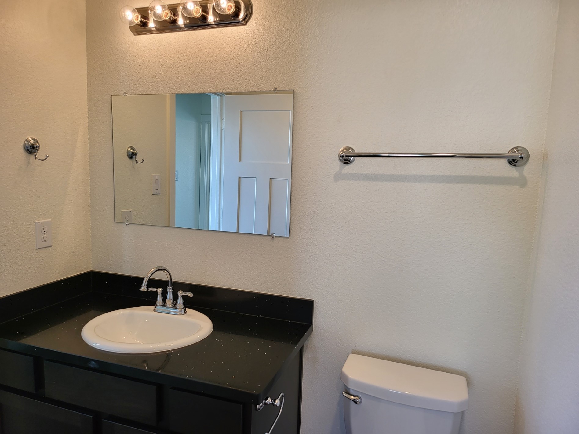 21155 Gosling Road, Unit 45B Spring, TX 77388 - Photo 27 of 33 a bathroom with a sink vanity mirror and toilet