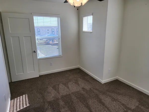 a view of an empty room with a window