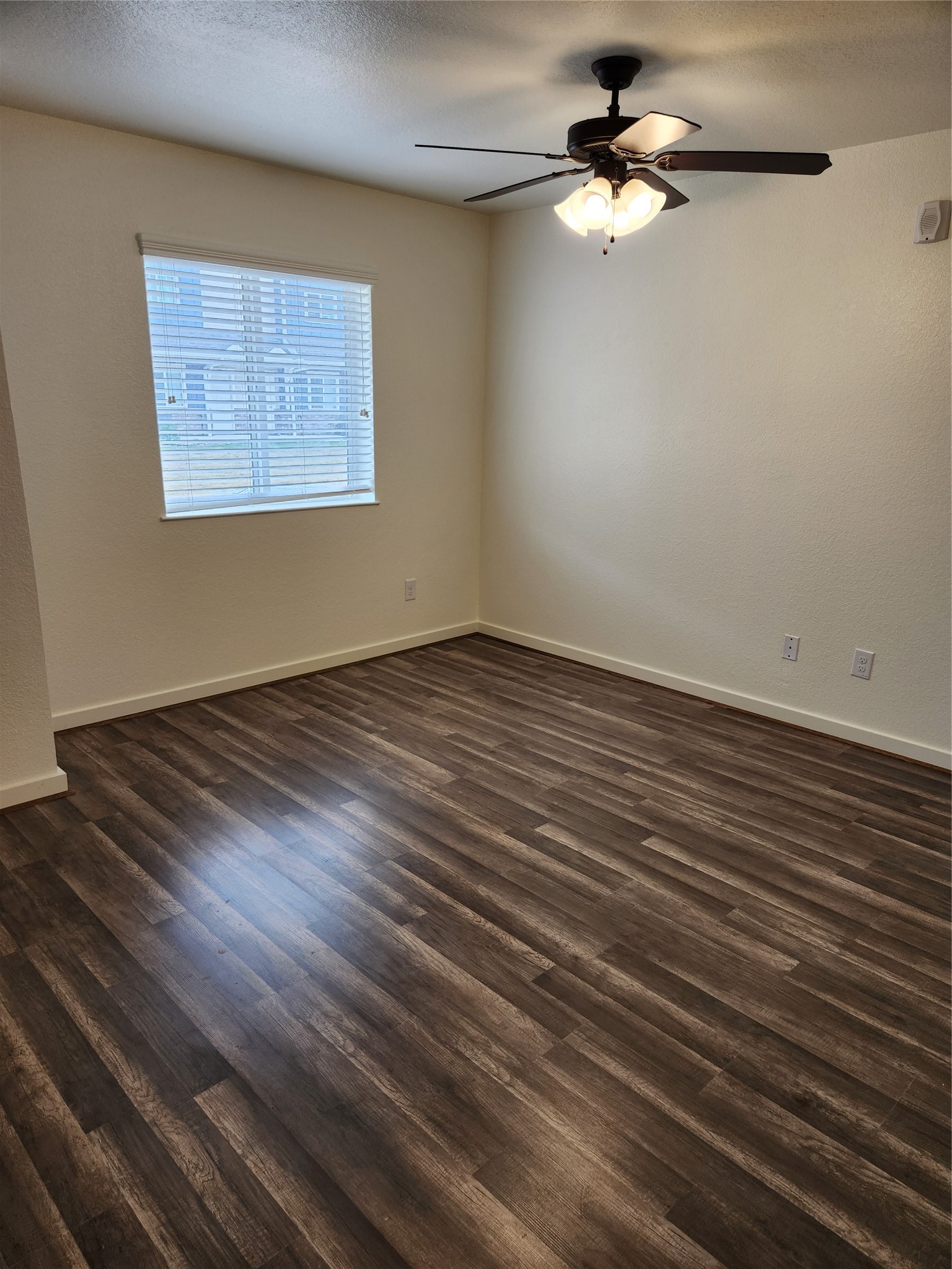 21155 Gosling Road, Unit 45B Spring, TX 77388 - Photo 7 of 33 an empty room with wooden floor fan and windows