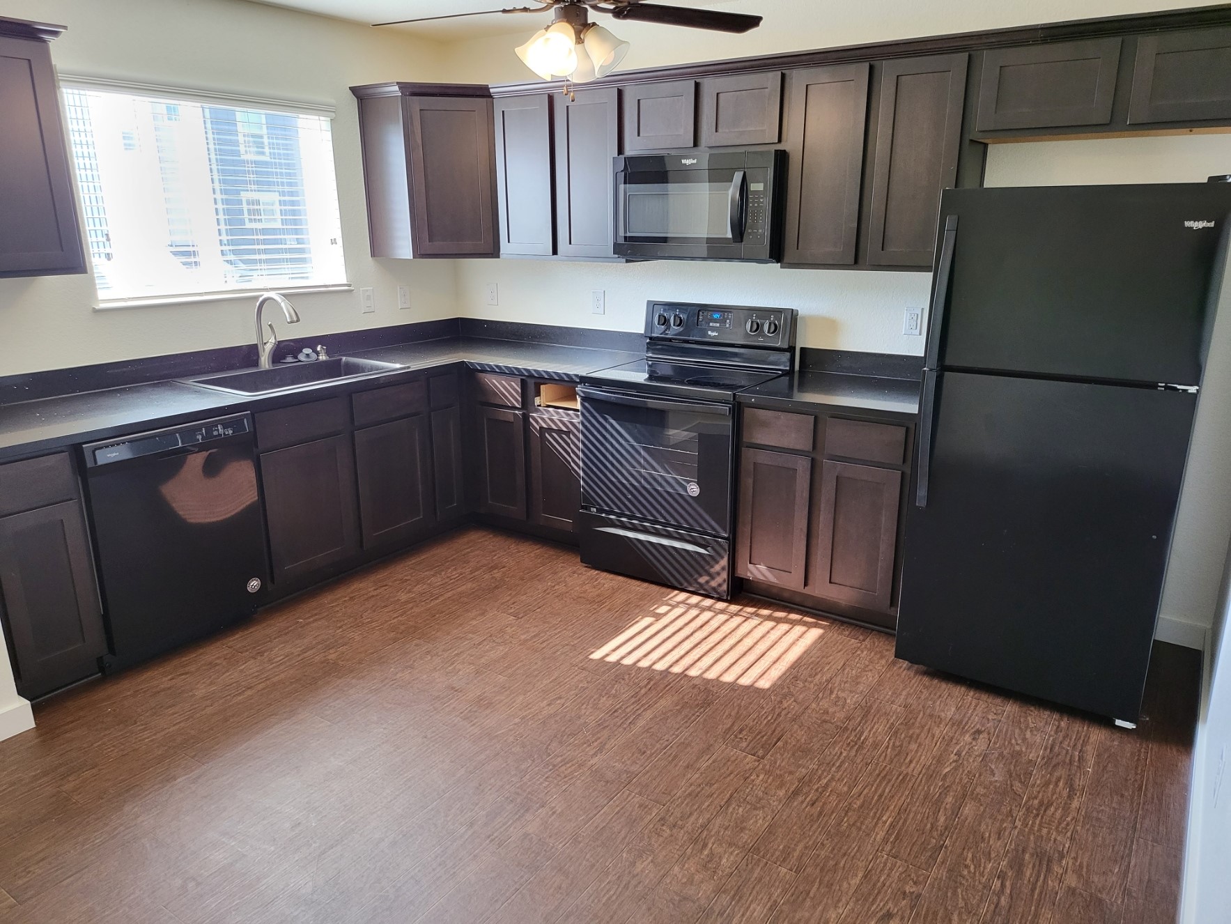 21155 Gosling Road, Unit 45B Spring, TX 77388 - Photo 8 of 33 a kitchen with stainless steel appliances granite countertop a refrigerator a sink and wooden cabinets