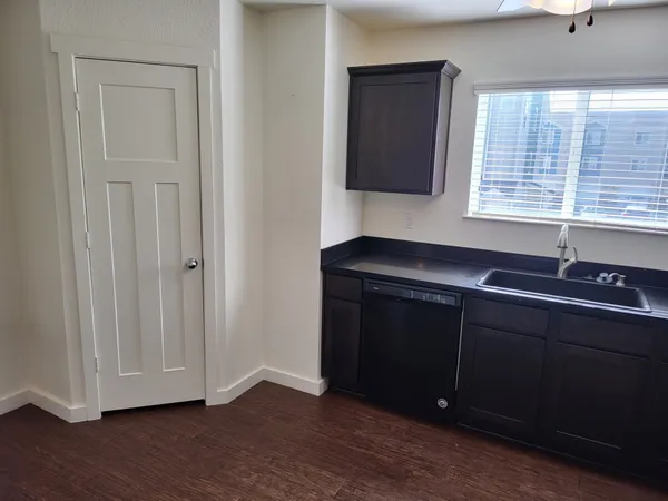 a kitchen with a sink and a window