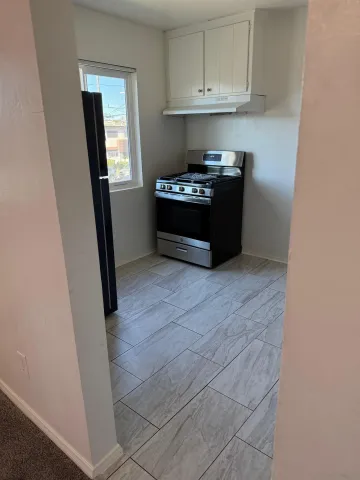 a utility room with cabinets