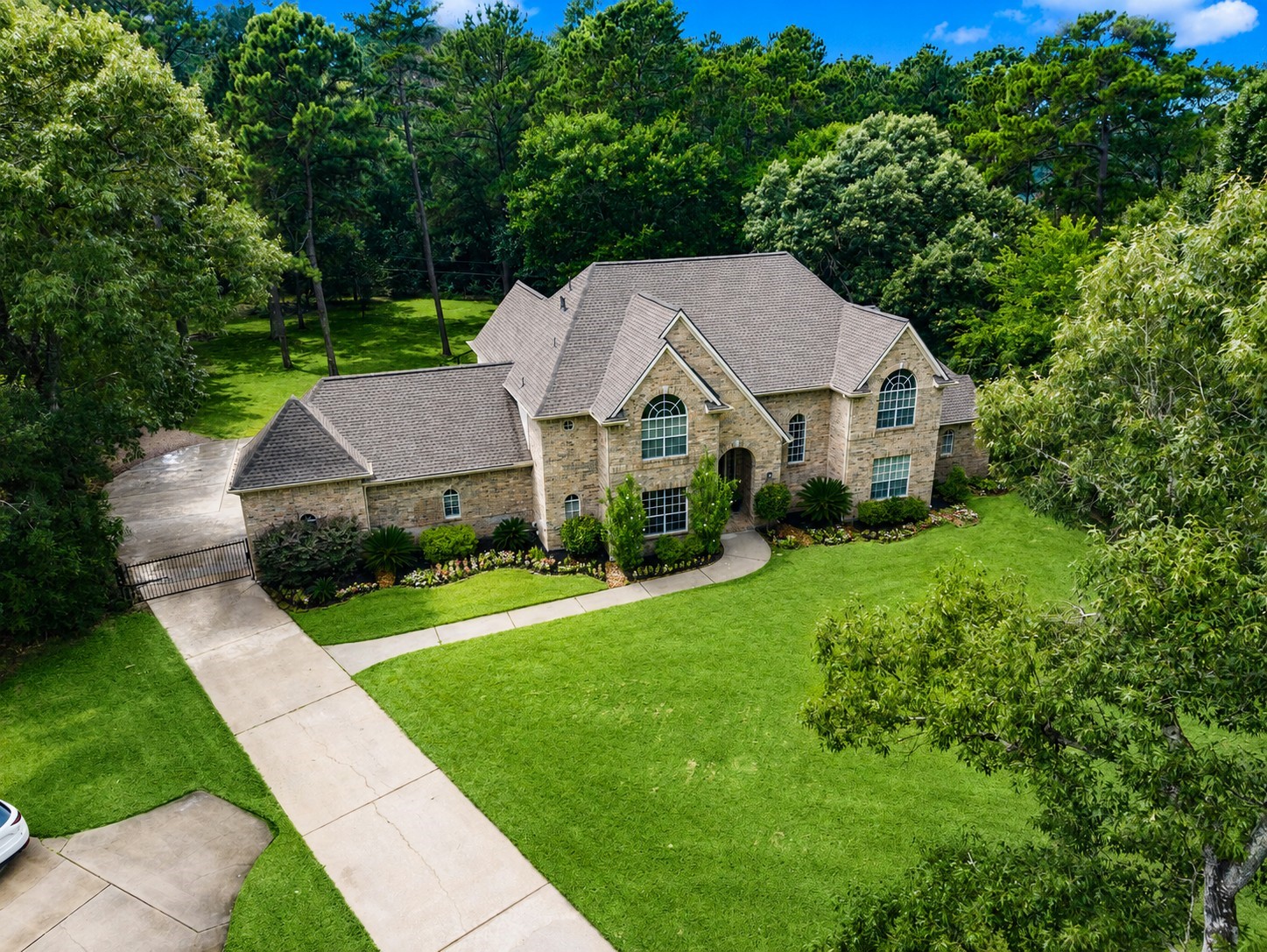 2326 Timbergreen Circle Magnolia, TX 77355 - Photo 2 of 43 a aerial view of a house in front of a yard with plants and large trees
