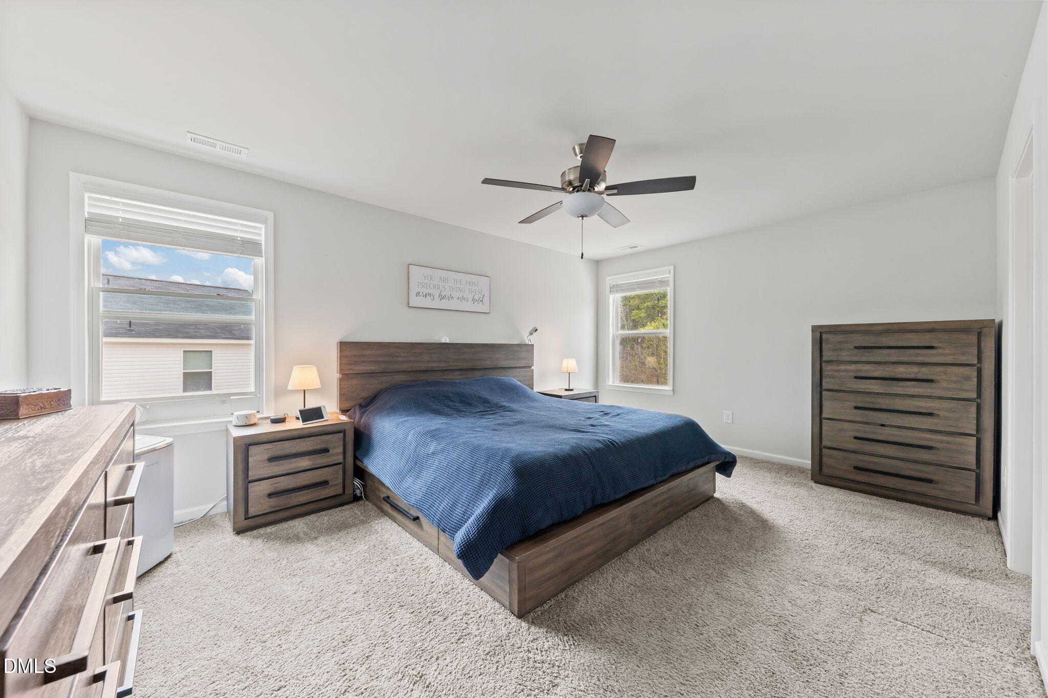 174 Cobra Lane Raeford, NC 28376 - Photo 16 of 32 a bedroom with a bed and a chandelier