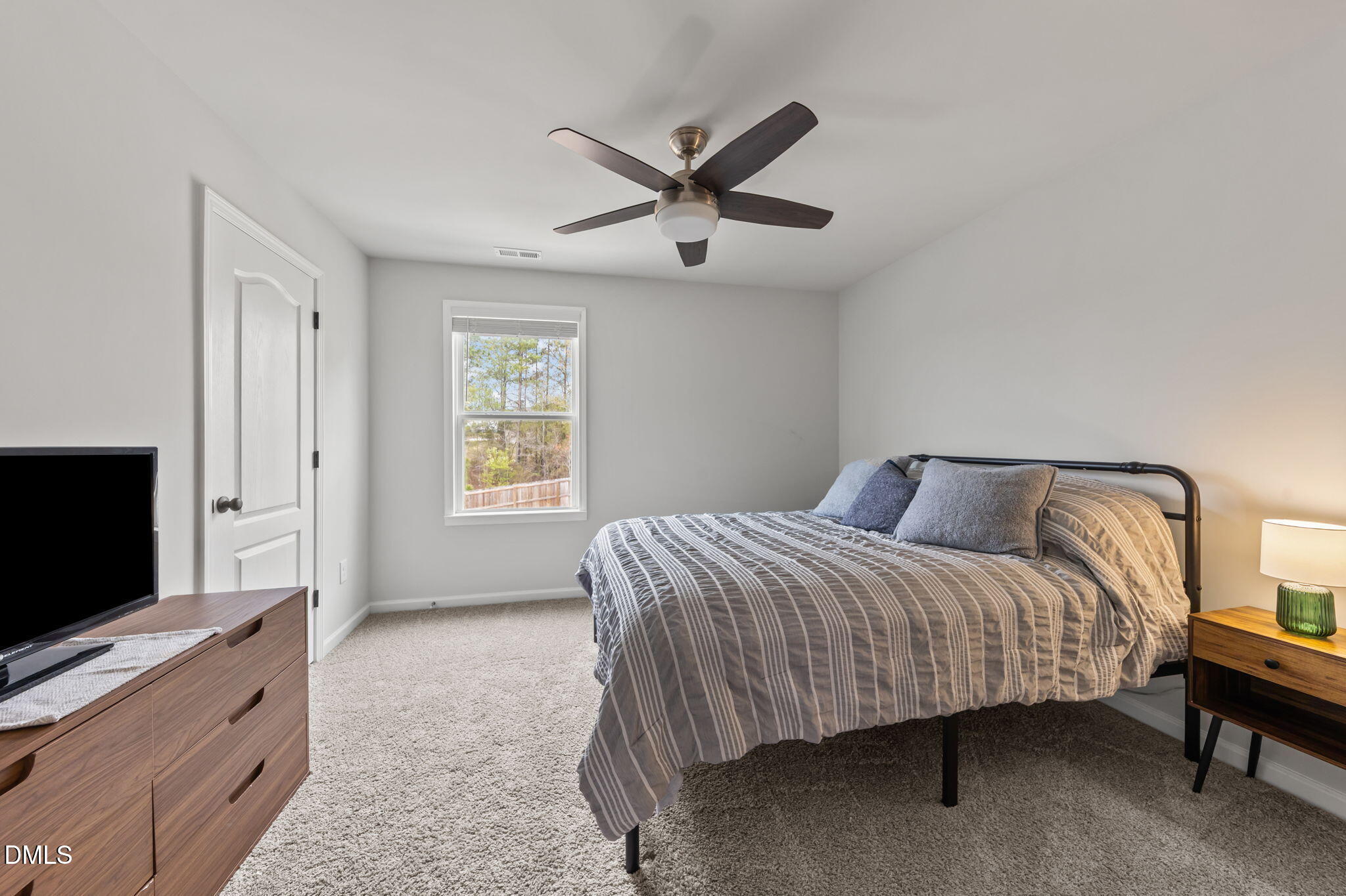 174 Cobra Lane Raeford, NC 28376 - Photo 20 of 32 a bedroom with a bed and a flat screen tv