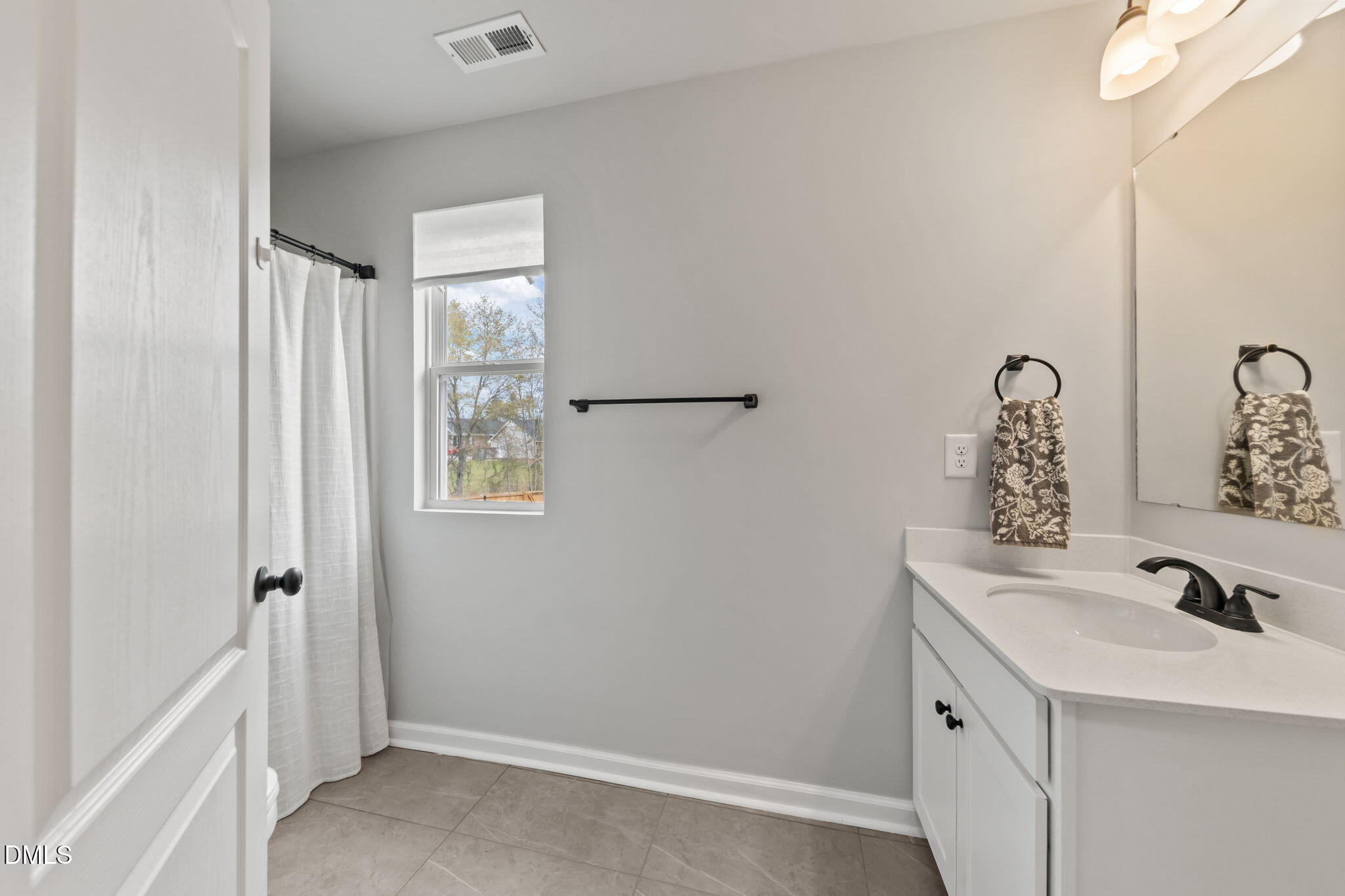174 Cobra Lane Raeford, NC 28376 - Photo 21 of 32 a bathroom with a sink and a mirror