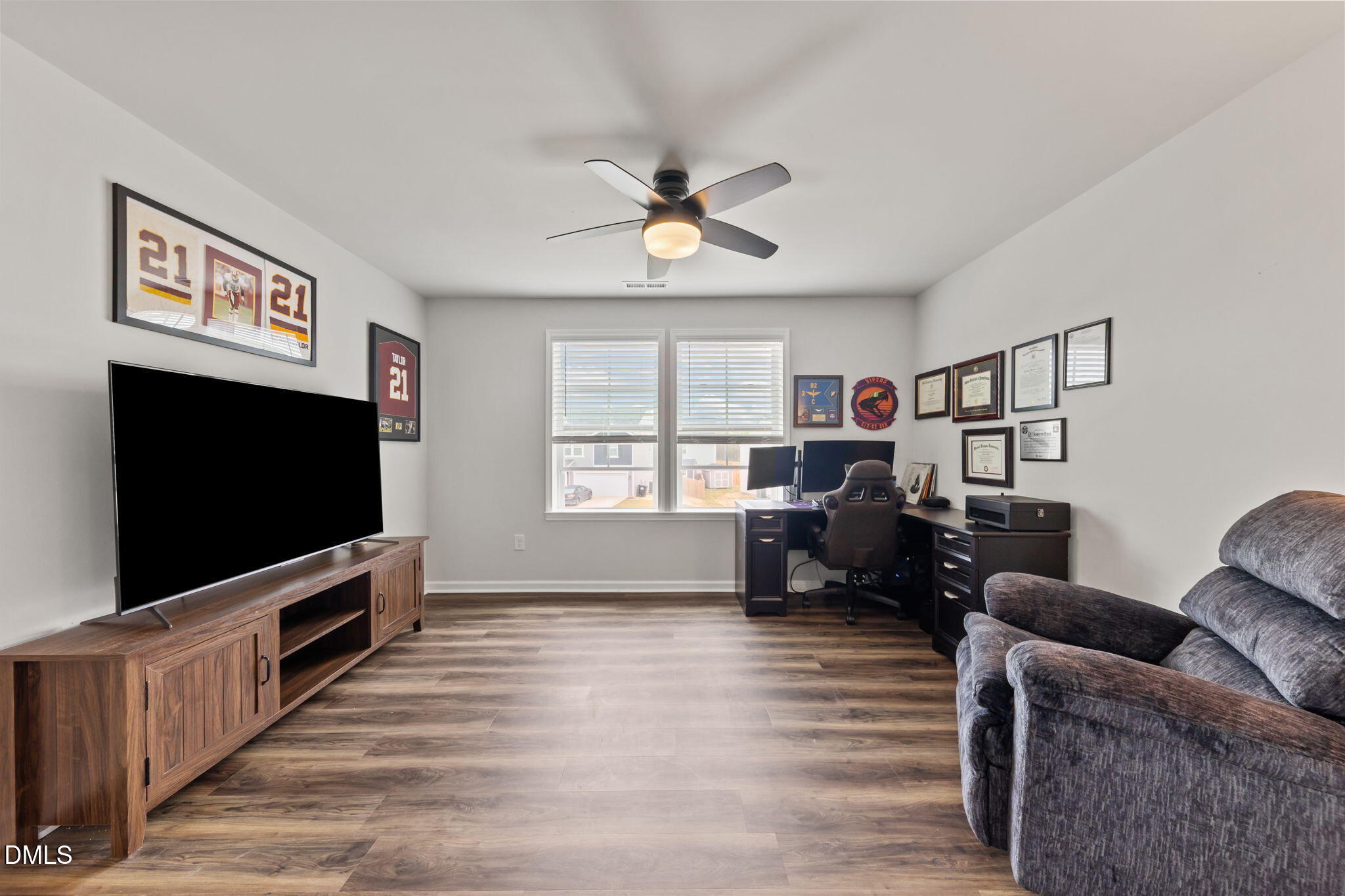 174 Cobra Lane Raeford, NC 28376 - Photo 22 of 32 a living room with furniture and a flat screen tv