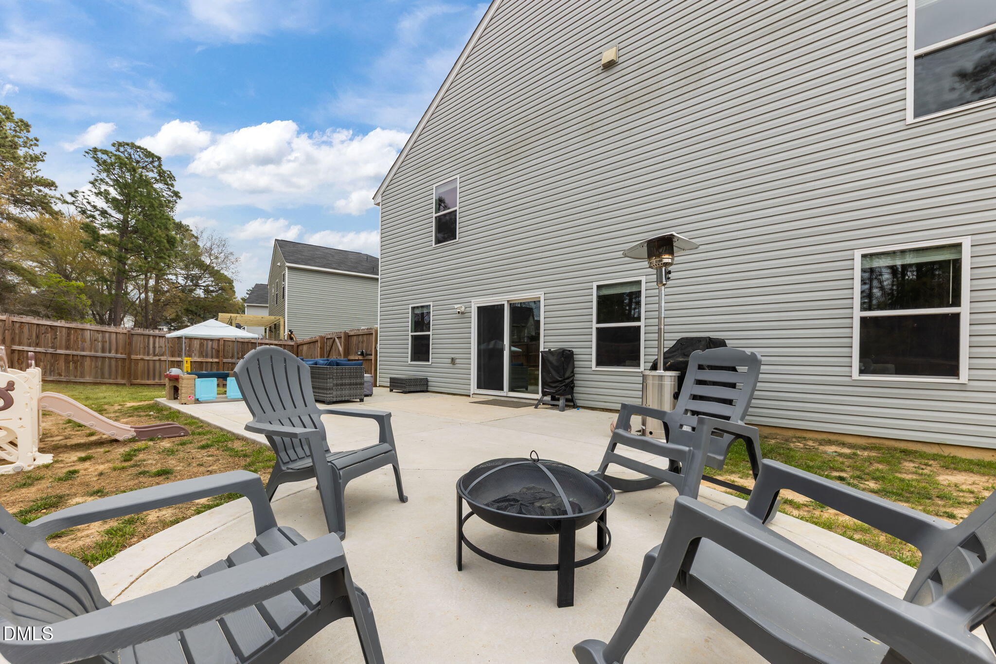 174 Cobra Lane Raeford, NC 28376 - Photo 25 of 32 a view of a patio with a dining table and chairs with wooden floor
