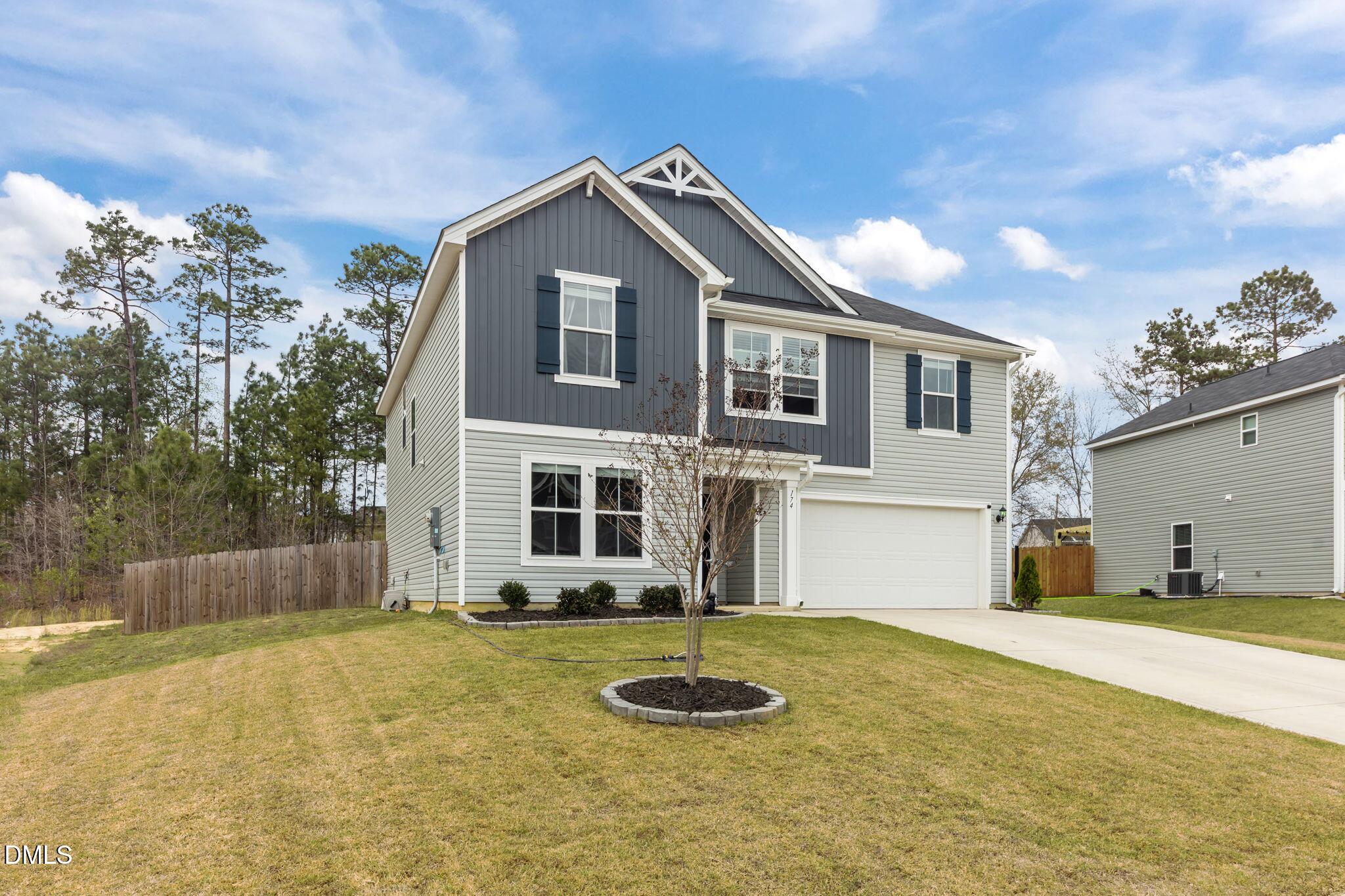 174 Cobra Lane Raeford, NC 28376 - Photo 26 of 32 a front view of a house with a yard