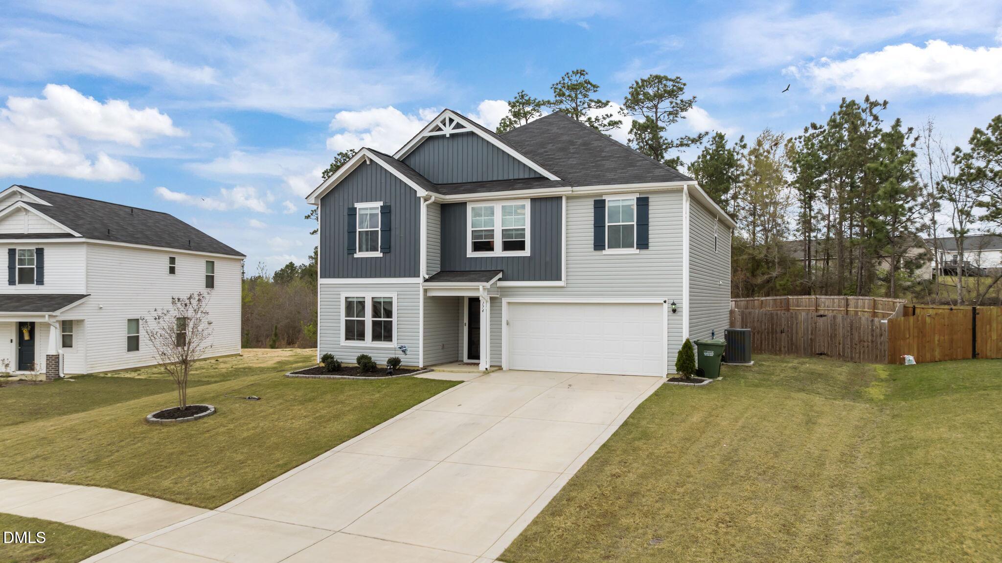 174 Cobra Lane Raeford, NC 28376 - Photo 3 of 32 a front view of a house with a yard