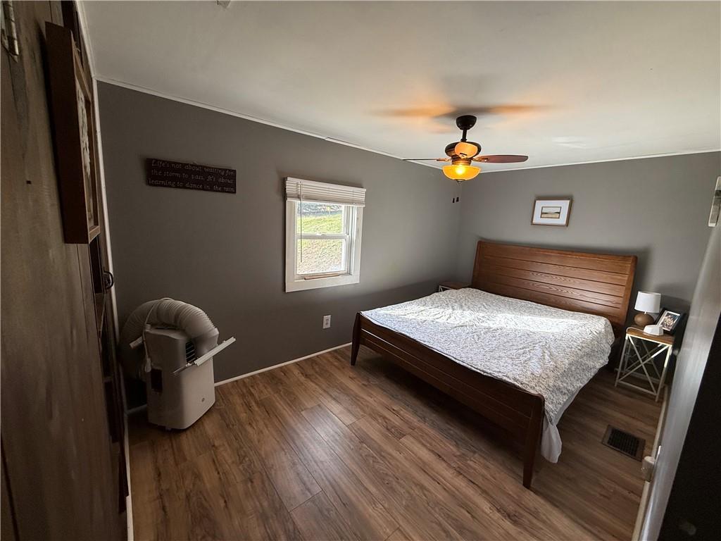 11 Boddorf Road Ringgold, PA 15770 - Photo 10 of 17 a bedroom with a bed and a window