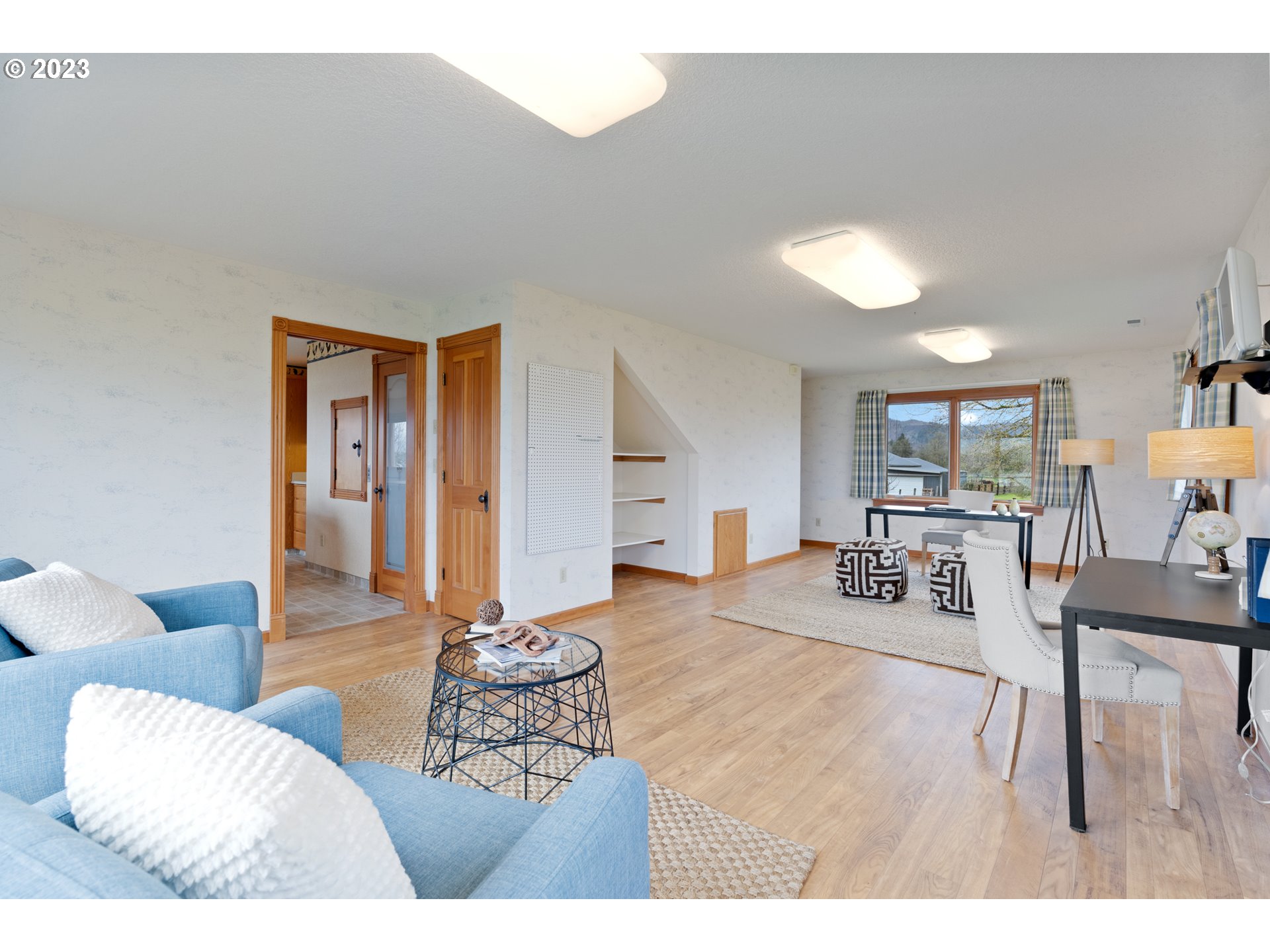 15140 Northwest Gillihan Road Portland, OR 97231 - Photo 17 of 34 a living room with furniture and a wooden floor