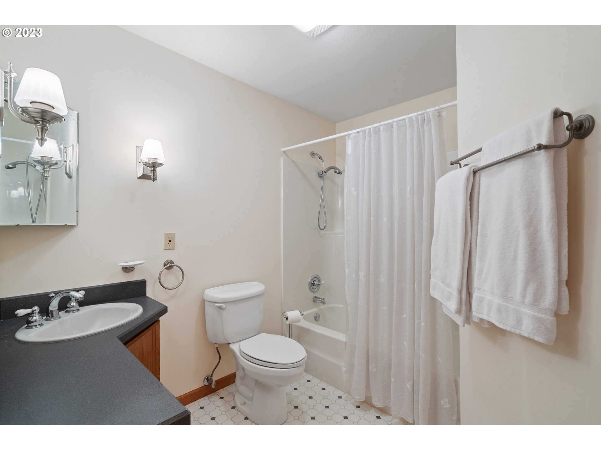 15140 Northwest Gillihan Road Portland, OR 97231 - Photo 26 of 34 a bathroom with a sink a toilet and shower