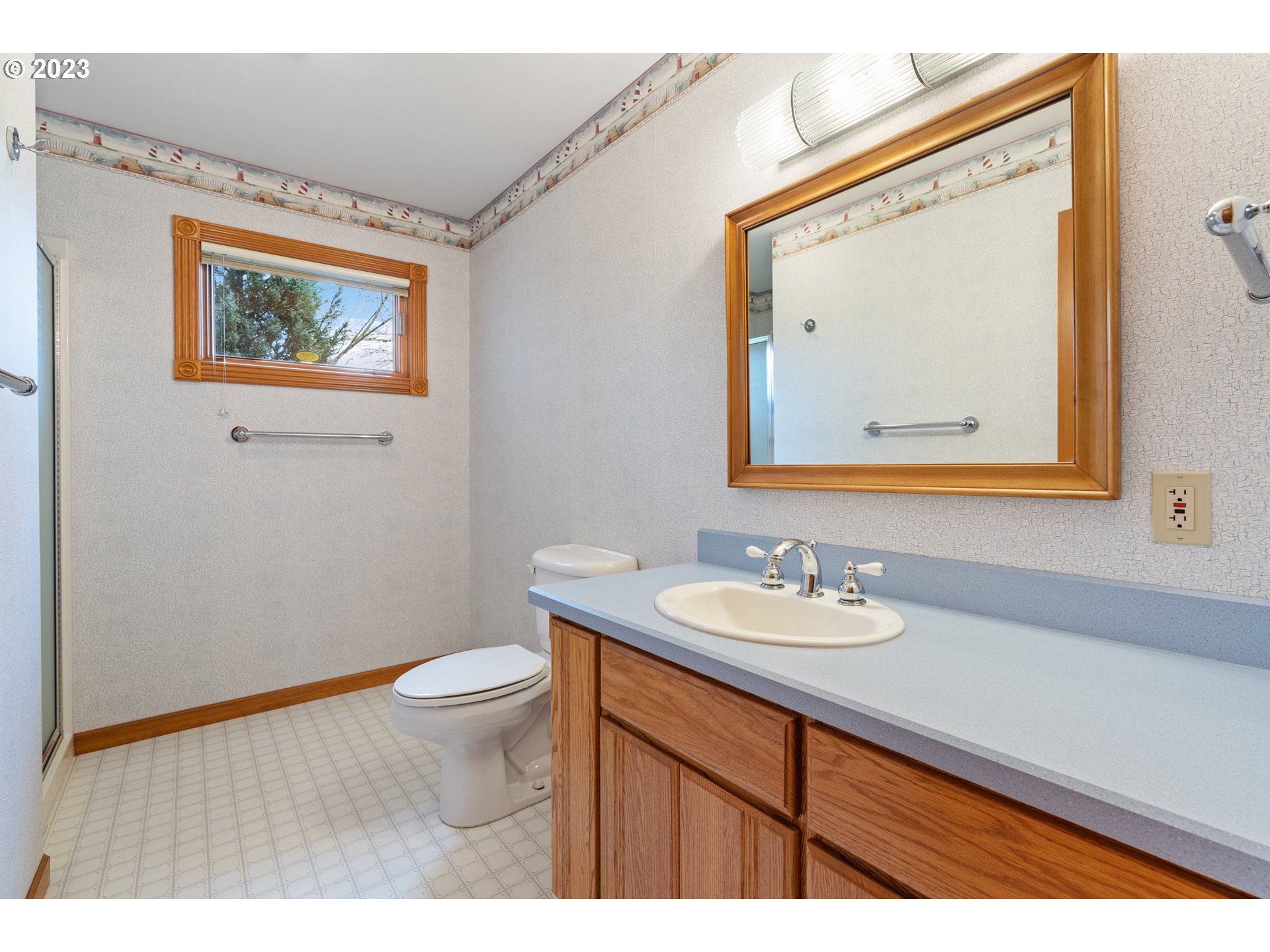 15140 Northwest Gillihan Road Portland, OR 97231 - Photo 27 of 34 a bathroom with a sink and a mirror