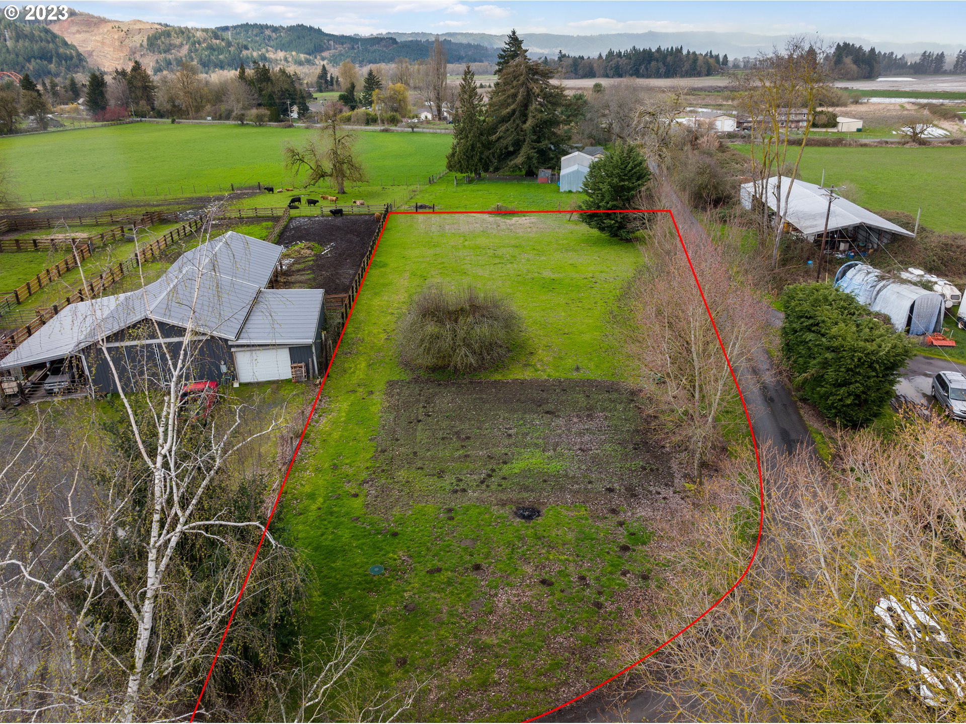 15140 Northwest Gillihan Road Portland, OR 97231 - Photo 32 of 34 an aerial view of a house with a yard and lake view