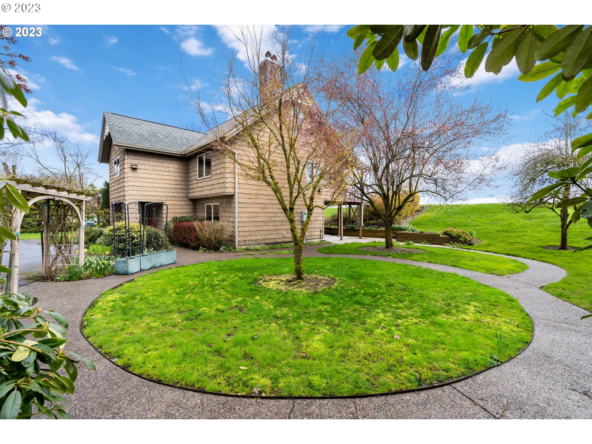 15140 Northwest Gillihan Road Portland, OR 97231 - Photo 34 of 34 a view of a backyard with a garden