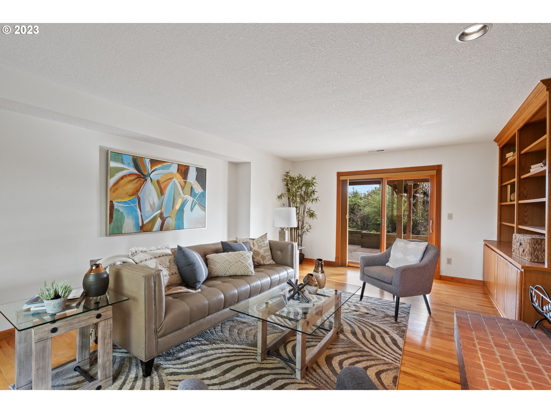 15140 Northwest Gillihan Road Portland, OR 97231 - Photo 6 of 34 a living room with furniture a rug and a large window