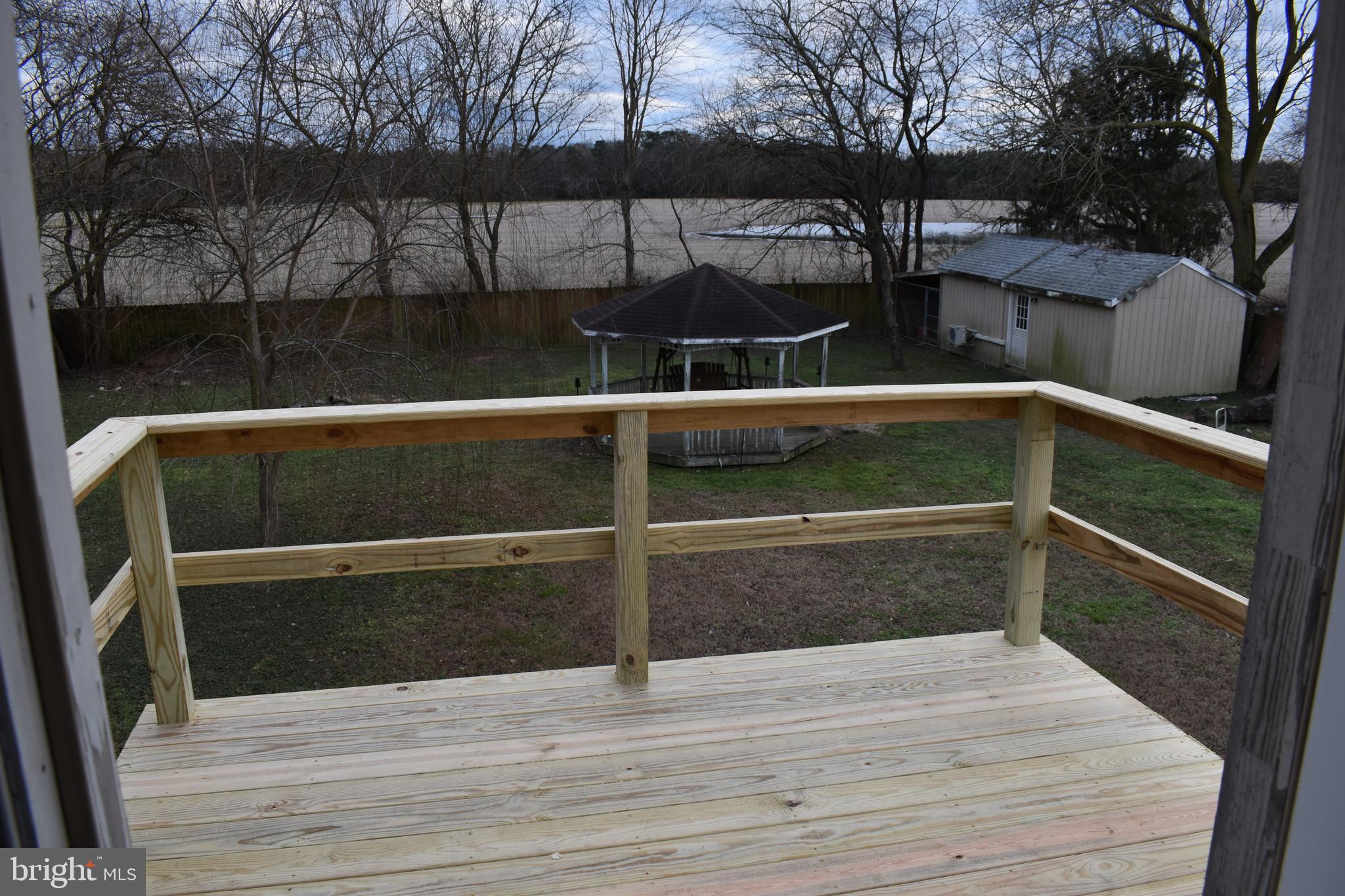 6181 Bethlehem Road Preston, MD 21655 - Photo 9 of 35 VIEW OF REAR YARD AN FARMLAND FROM SECOND FLOOR DE