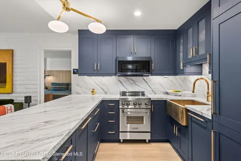 a kitchen with a stove and a sink