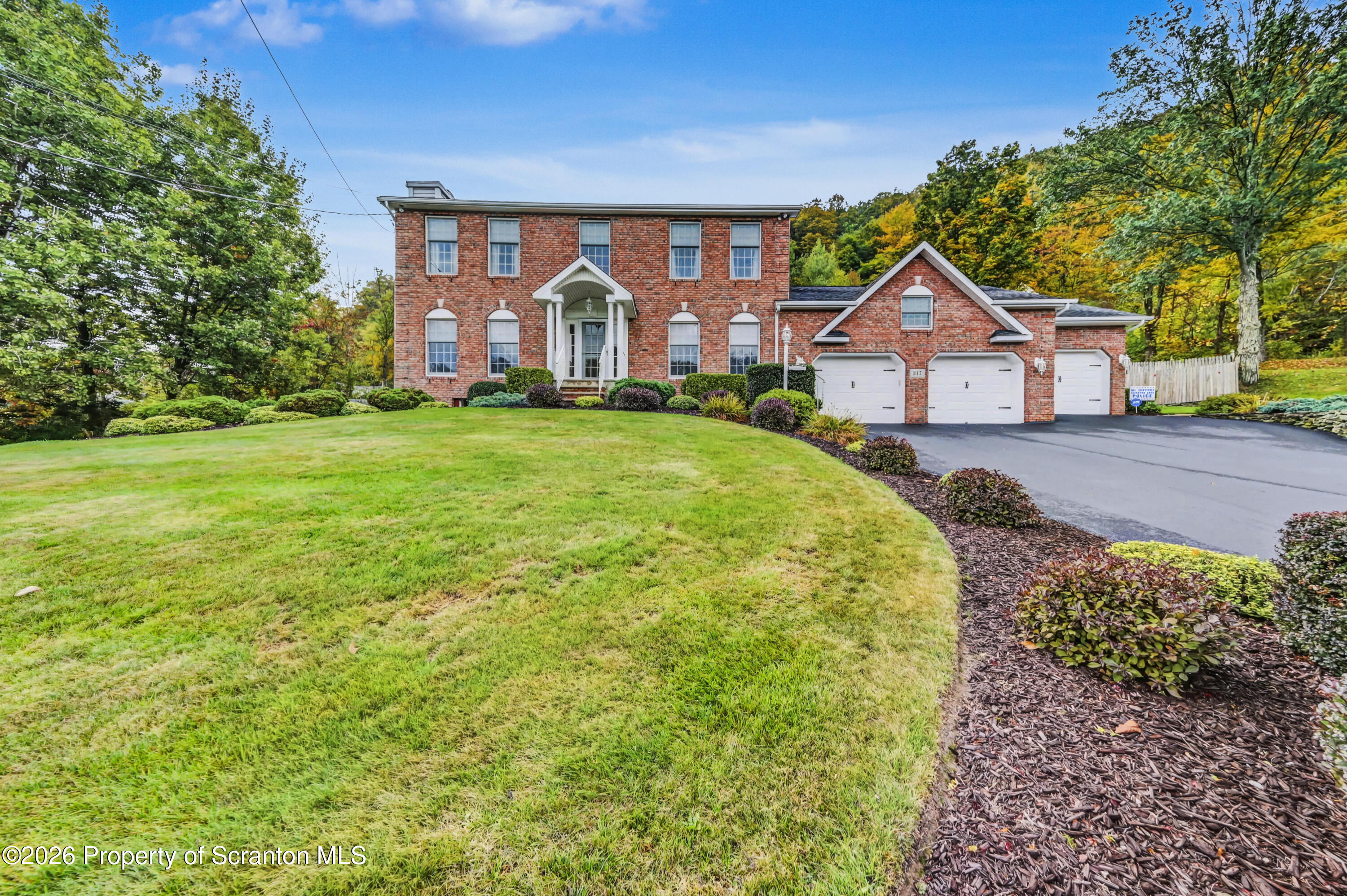 317 Bailey Street Clarks Summit, PA 18411 - Photo 1 of 95 a front view of a house with garden