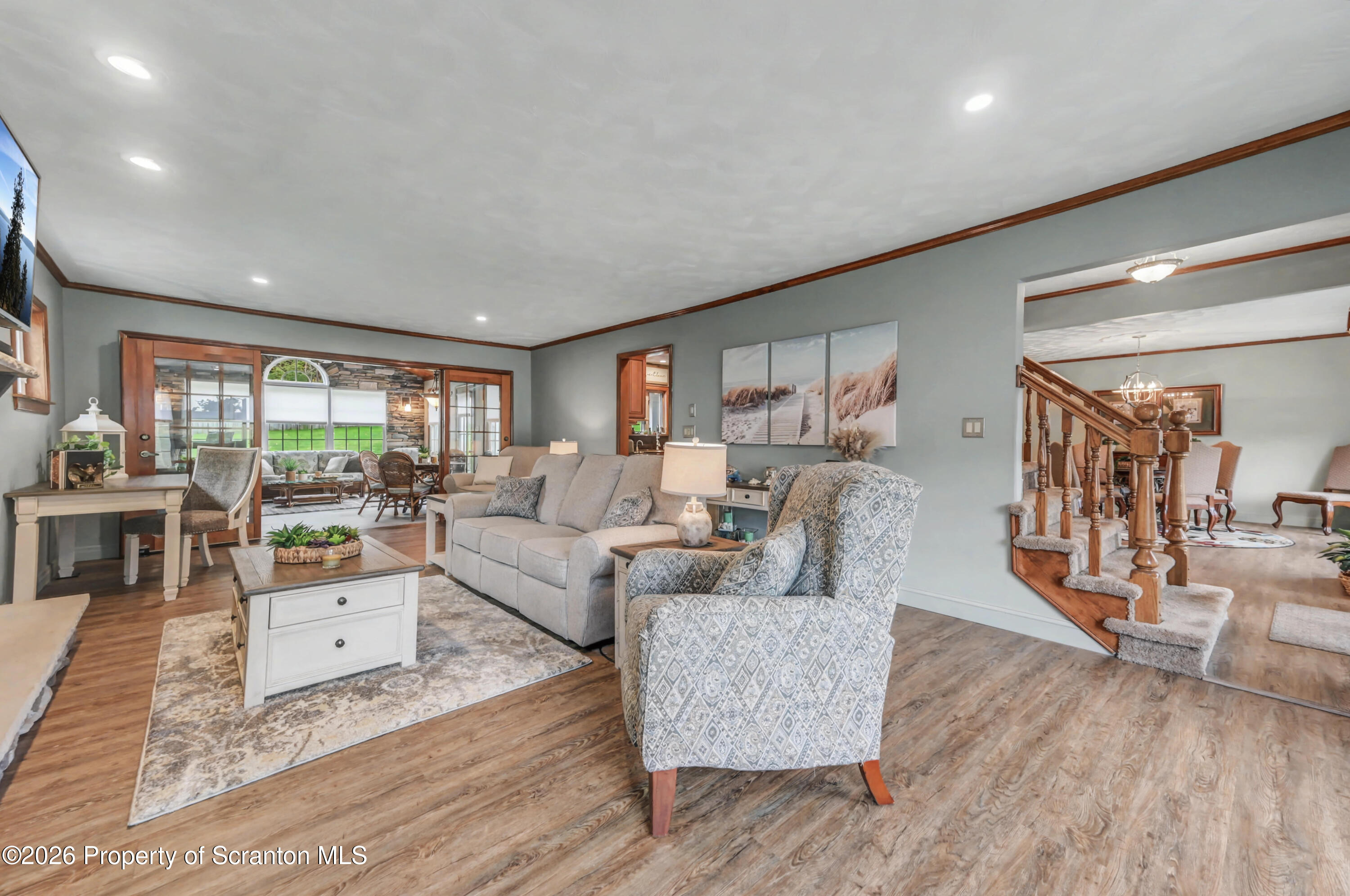 317 Bailey Street Clarks Summit, PA 18411 - Photo 11 of 95 a living room with furniture and a wooden floor