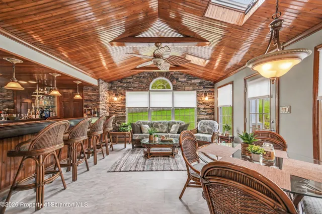 a kitchen with stainless steel appliances granite countertop a refrigerator a oven and a sink