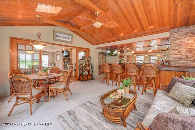 a kitchen with stainless steel appliances granite countertop a refrigerator a sink and a stove